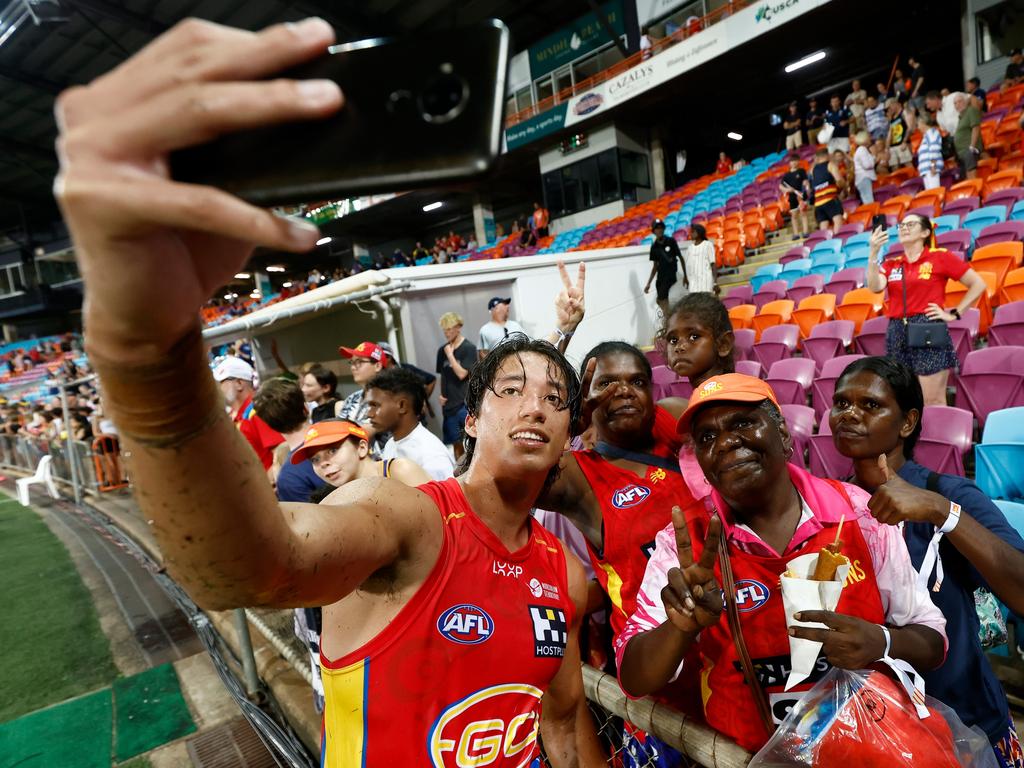 Gold Coast’s Alex Davies takes a selfie with fans in Darwin. Picture: Michael Willson/AFL Photos via Getty Images