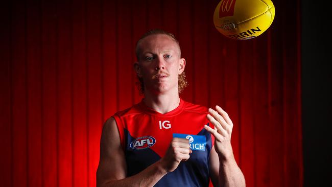 MELBOURNE, AUSTRALIA - FEBRUARY 27: Clayton Oliver poses for a photograph during the Melbourne Demons 2023 Official Team Photo Day at AAMI Park on February 27, 2023 in Melbourne, Australia. (Photo by Michael Willson/AFL Photos)