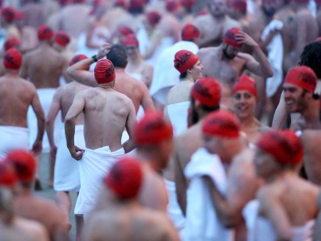 Swimmers on the beach at Sandy Bay preparing for the Dark Mofo Winter Solstice Nude Swim. Picture: NIKKI DAVIS-JONES