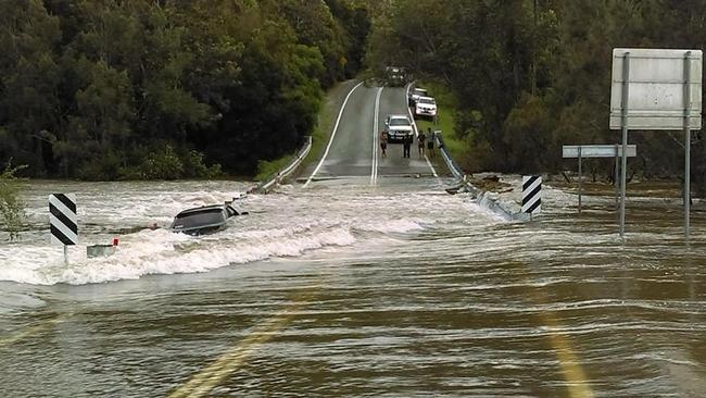 Two drivers clearly forget that 'if it's flooded, forget it' at Latimers Crossing Rd, Gilston. Picture: Rural Fire Brigade