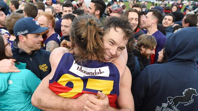 Diggers Rest’s Taylor Hine and Matthew Krul embrace after the final siren. Picture: Josie Hayden