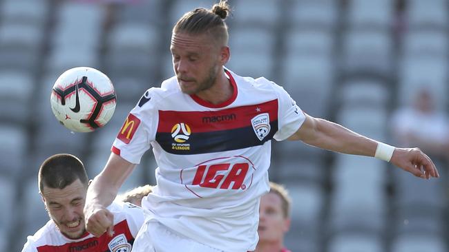 GOSFORD, AUSTRALIA - NOVEMBER 04:  Ken Ilso of Adelaide heads the ball during the round three A-League match between the Central Coast Mariners and Adelaide United at Central Coast Stadium on November 4, 2018 in Gosford, Australia.  (Photo by Tony Feder/Getty Images)