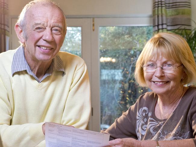 senior couple looking over paperwork; superannuation generic happy