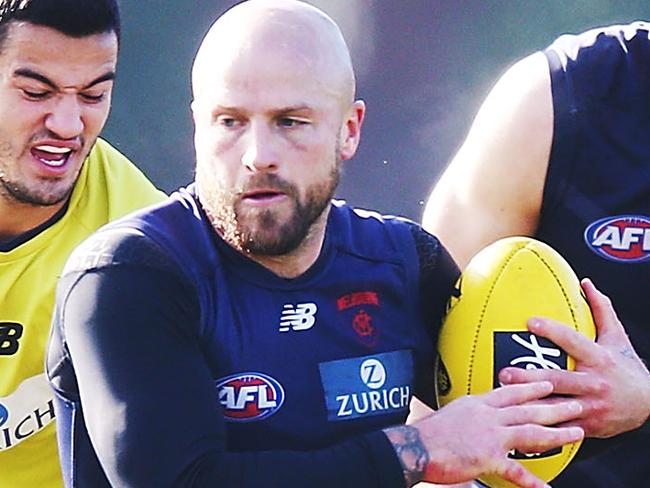 MELBOURNE, AUSTRALIA - JUNE 19: Nathan Jones of the Demons runs with the ball during a Melbourne Demons AFL training session at Gosch's Paddock on June 19, 2018 in Melbourne, Australia.  (Photo by Michael Dodge/Getty Images)