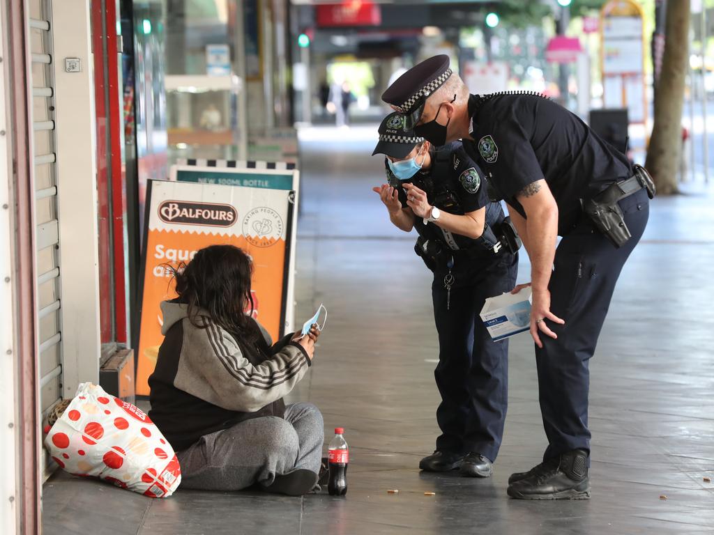 SA Police have been handing out masks on the streets of Adelaide. Picture: Tait Schmaal.