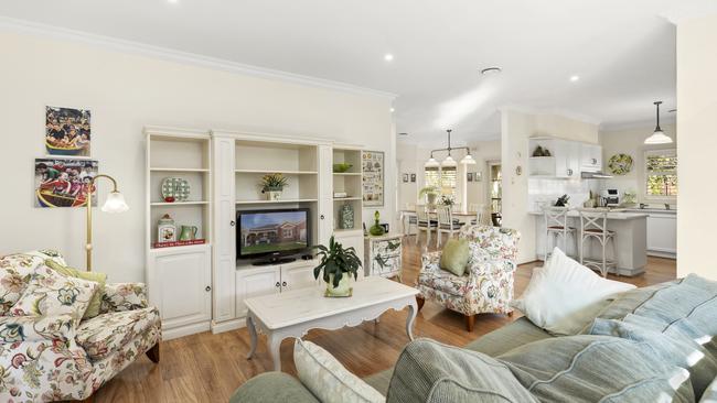 The open-plan living area has timber floors.