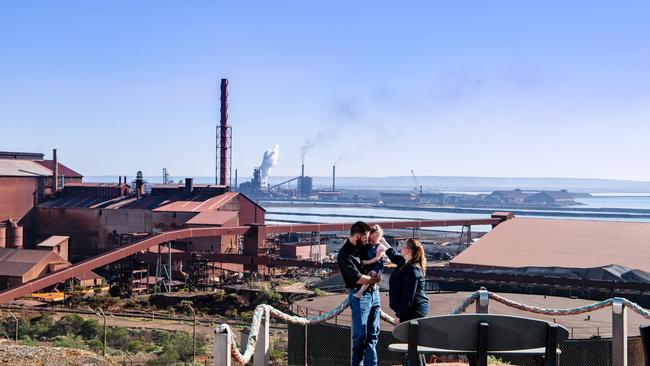 Tom Wilson, 3-year-old Charlotte and Alicia Wilson overlooking the steelworks in Whyalla. Picture: Morgan Sette/The Australian