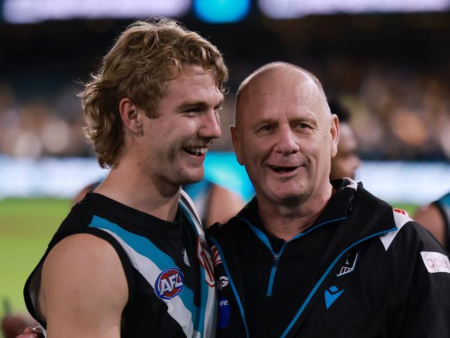 ADELAIDE, AUSTRALIA – SEPTEMBER 13: Jason Horne-Francis and Ken Hinkley of the Power celebrate their win during the 2024 AFL Second Semi Final match between the Port Adelaide Power and the Hawthorn Hawks at Adelaide Oval on September 13, 2024 in Adelaide, Australia. (Photo by James Elsby/AFL Photos via Getty Images)