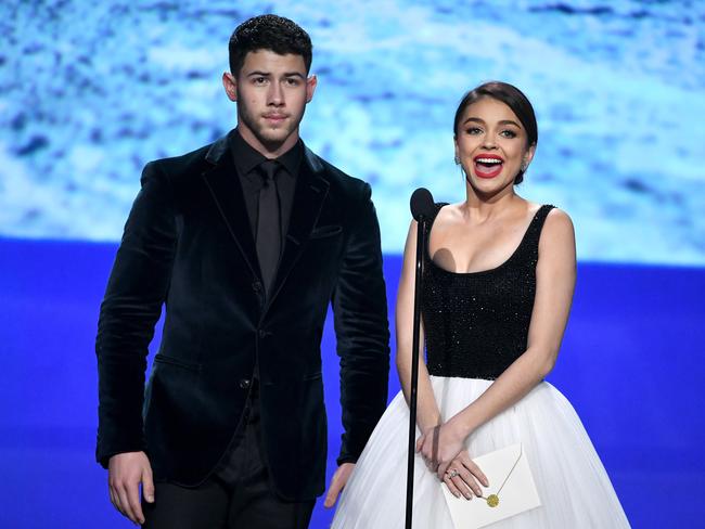 Nick Jonas and Sarah Hyland speak onstage during The 23rd Annual Critics’ Choice Awards at Barker Hangar on January 11, 2018 in Santa Monica, California. Picture: Getty