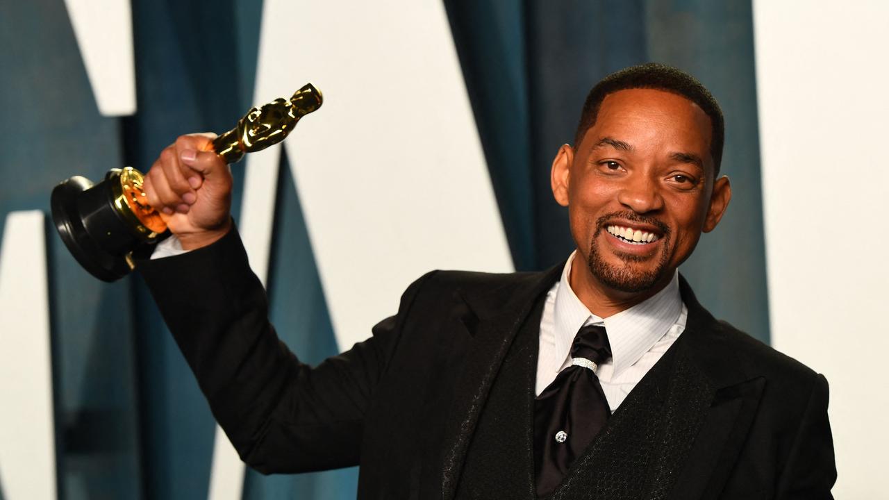 Will Smith holds his award for Best Actor in a Leading Role shortly after he slapped Chris Rock. (Photo by Patrick T. FALLON / AFP)