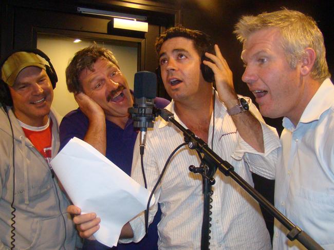 Jason Dunstall (left), Brian Taylor, Garry Lyon and Danny Frawley recording a song during their days on Triple M together.
