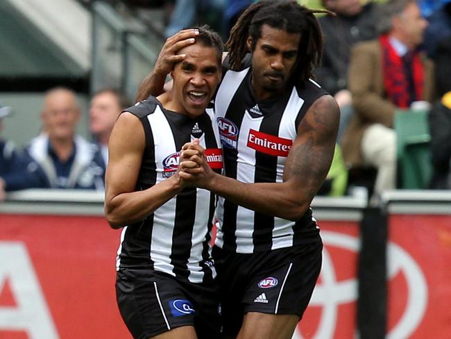 Andrew Krakouer and Héritier Lumumba celebrate a Krakouer goal in the 2011 Grand Final.