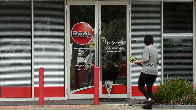 Flowers left at the scene where a Julie Seed died and her co-worker, Sue, 50, was left with serious injuries after a horrific stabbing attack in Adelaide on Wednesday. Picture: NCA NewsWire / Dean Martin