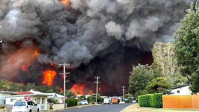 Beach St, Harrington, 16 months ago when bushfires came perilously close to destroying homes. Picture: Kelly-ann Oosterbee/AFP