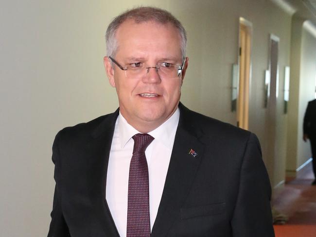 Treasurer Scott Morrison walks to Ch9 studios at Parliament House in Canberra this morning to be interviewed by Laurie Oaks. Picture: Ray Strange.