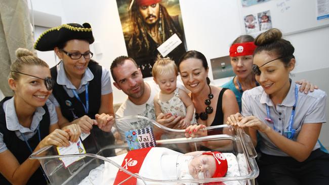 Hannah Polites (left) working as a midwife at Gold Coast University Hospital. Photo: Kit Wise