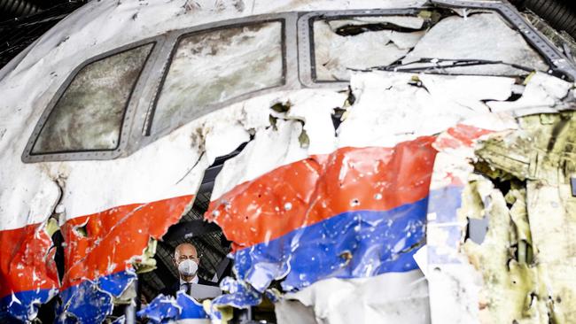 Presiding judge Hendrik Steenhuis views the reconstructed wreckage of Malaysia Airlines Flight MH17, at the Gilze-Rijen military airbase, southern Netherlands in 2021. Picture: Sem van der Wal / ANP / AFP.