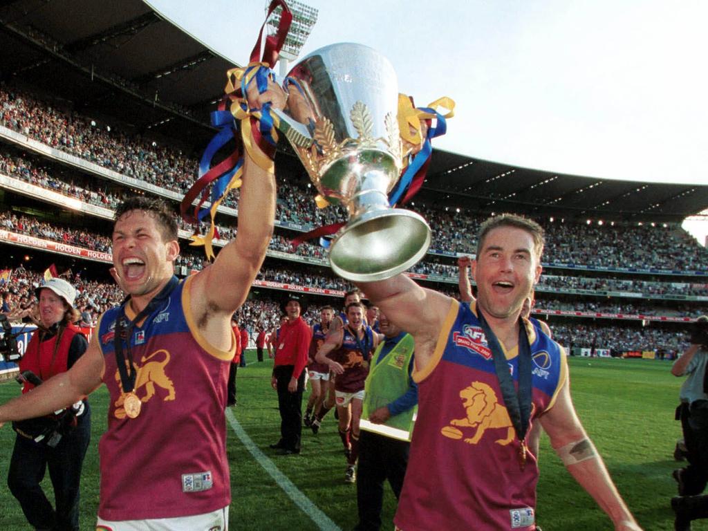 Marcus Ashcroft and Chris Johnson celebrate Brisbane’s 2001 Grand Final victory.