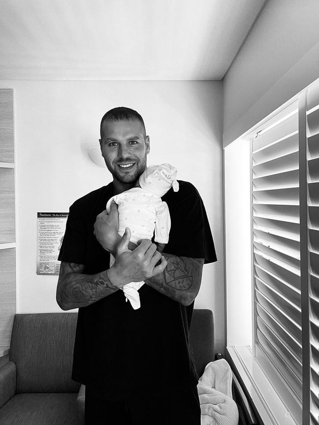 Buddy Franklin with baby son, Rocky.