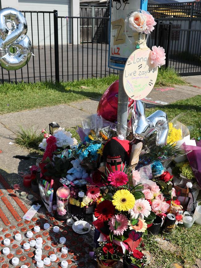 The scene is now a shrine to Iyzaa. Picture: Tim Hunter.