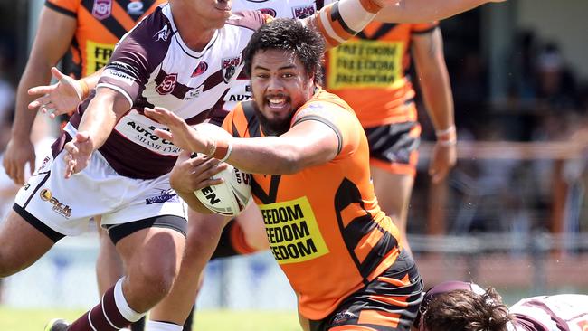 Denzal Ngati takes a hit up against Burleigh. Picture by Richard Gosling