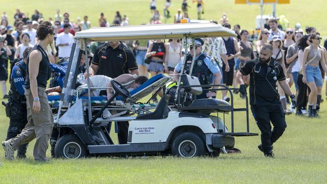 Another person was treated on a gurney outside the entrance to the festival. Picture: NewsWire / Simon Bullard