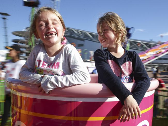 Willow and Faith Evans, 5, enjoying the Royal Tea Cups ride at the Royal Easter Show today.Picture: Justin Lloyd