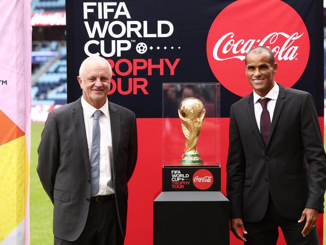 Socceroos coach Graham Arnold (left) and Rivaldo like the look of the World Cup trophy. Picture: Matt King/Getty Images for FIFA