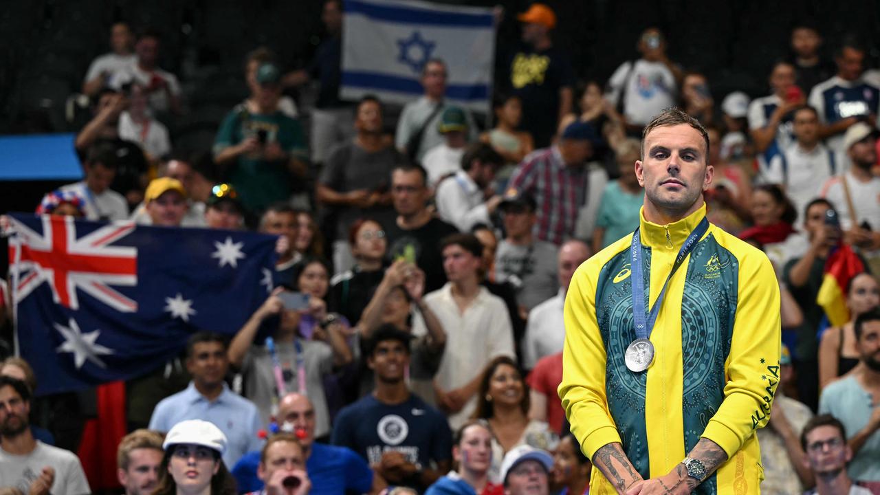 Silver medallist Australia's Kyle Chalmers stands on the podium of the men's 100m freestyle swimming event during the Paris 2024 Olympic Games at the Paris La Defense Arena in Nanterre, west of Paris, on July 31, 2024. (Photo by Jonathan NACKSTRAND / AFP)