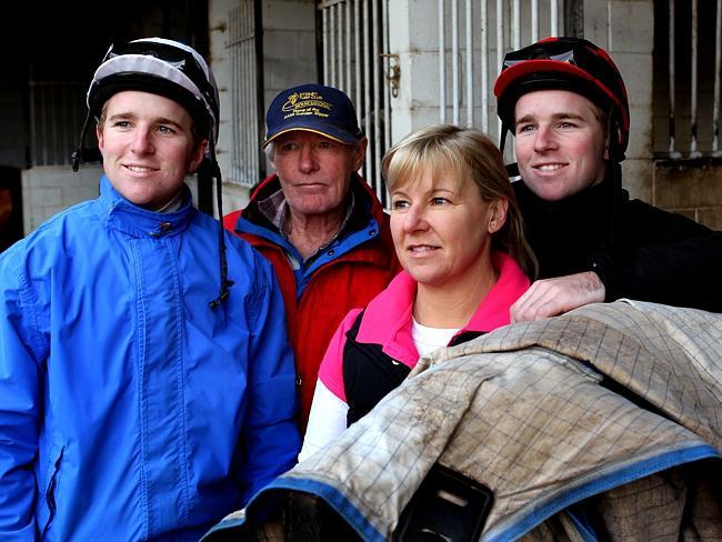 Apprentice jockeys Nathan (left) and Tommy Berry with parents Julie and trainer dad Kevin at their family's stables at Warwick Farm Racecourse.