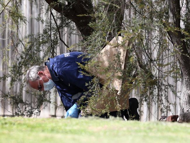 A forensic investigator examines the scene. Picture: Yuri Kouzmin