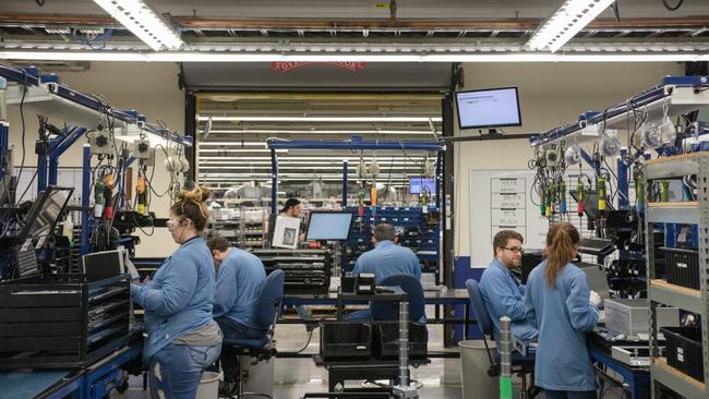 Workers at Washington’s Schweitzer Engineering Laboratories, where in-house education is prioritised. Picture: Rajah Bose/WSJ.