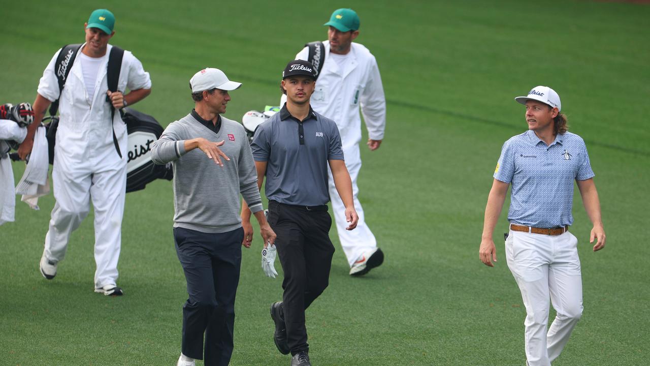 AUGUSTA, GEORGIA – APRIL 04: Amateur Harrison Crowe of Australia, Cameron Smith of Australia, and Adam Scott of Australia walk down the third fairway during a practice round prior to the 2023 Masters Tournament at Augusta National Golf Club on April 04, 2023 in Augusta, Georgia. (Photo by Andrew Redington/Getty Images)