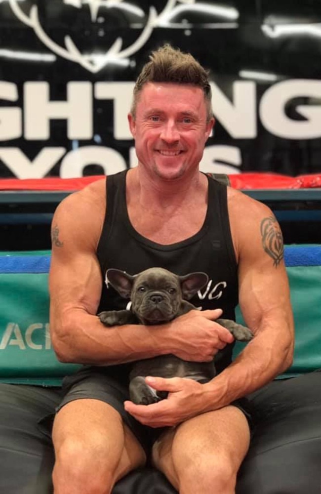 Paul Lyons with a French Bulldog puppy.