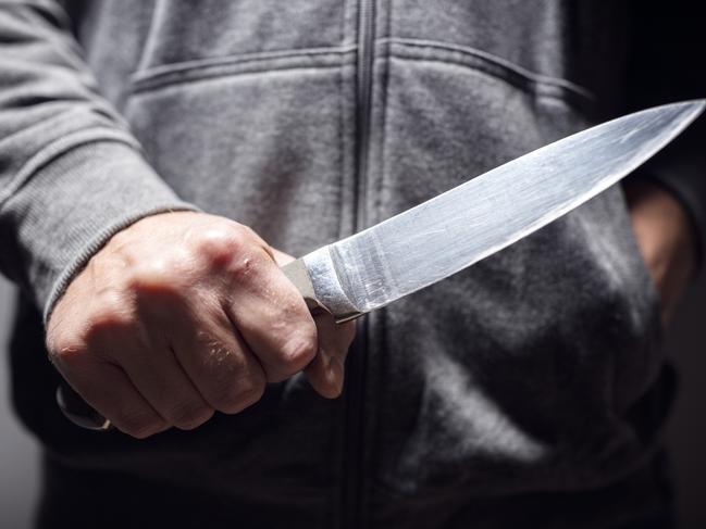 Generic crime Istock  -  Criminal with knife weapon threatening to stab