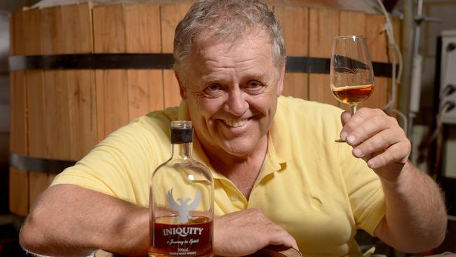 The Tin Shed Distilling Company ‘s Ian Schmidt with bottle of Iniquity. Picture: Keryn Stevens