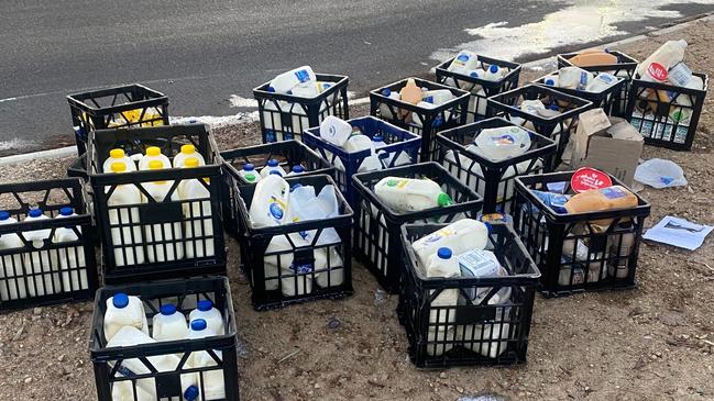 Hundreds of dollars worth of milk was scattered across a busy eastern suburbs roundabout ahead of peak hour. Picture: SA Police