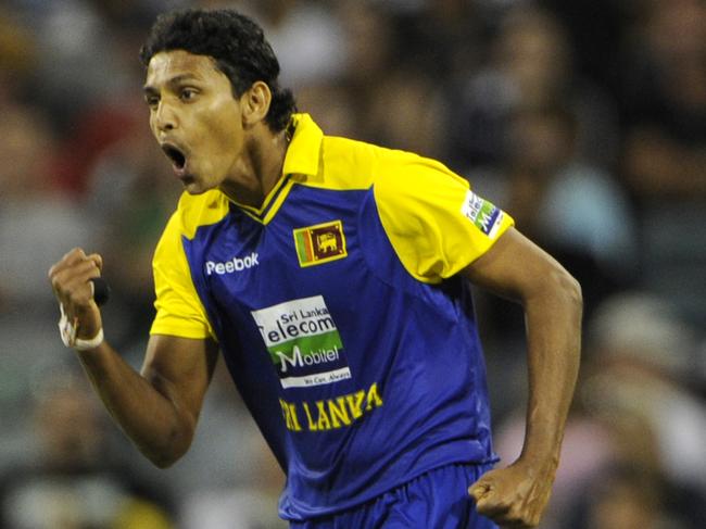 Suraj Randiv celebrates the wicket of Brad Haddin while playing for Sri Lanka against Australia in 2010.