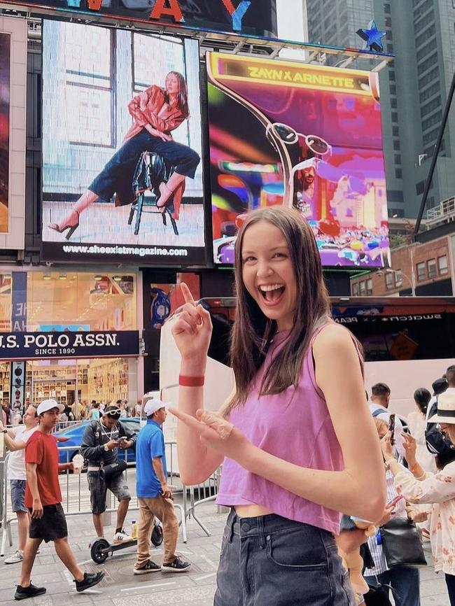 Tully Heinrich at Times Square in front of a billboard she is on. Picture: supplied