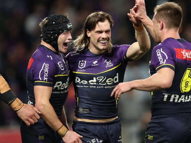 MELBOURNE, AUSTRALIA - SEPTEMBER 27:  Ryan Papenhuyzen of the Storm celebrates with team mates after scoring a try during the NRL Preliminary Final match between the Melbourne Storm and Sydney Roosters at AAMI Park on September 27, 2024 in Melbourne, Australia. (Photo by Cameron Spencer/Getty Images)