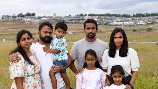 Box Hill residents Rekha, Aravind and Advait Vijay and Manori, Anjana, Liyana and Methmi Premaratne, pictured where the local school is proposed in Box Hill. Picture: Damian Shaw