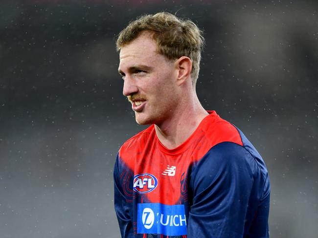 MELBOURNE, AUSTRALIA – JULY 13: Harrison Petty of the Demons warms up prior to the round 18 AFL match between Melbourne Demons and Essendon Bombers at Melbourne Cricket Ground, on July 13, 2024, in Melbourne, Australia. (Photo by Josh Chadwick/AFL Photos/via Getty Images.