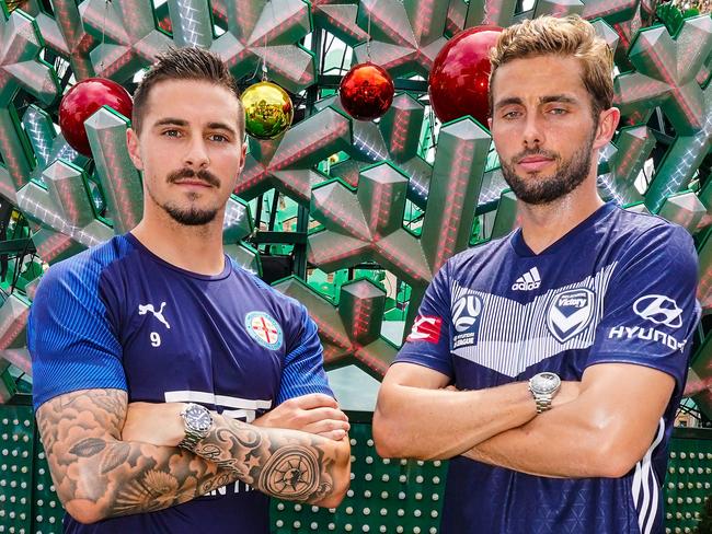 Melbourne Victory midfielder Jakob Poulsen and Melbourne City forward Jamie Maclaren pose in front of the Christmas tree at Federation Square during a press conference ahead of the A-League Christmas Derby in Melbourne, Wednesday, December 18, 2019. (AAP Image/Scott Barbour) NO ARCHIVING