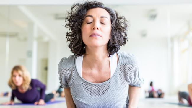 Mind-body practices like yoga promote relaxation. Picture: Getty Images