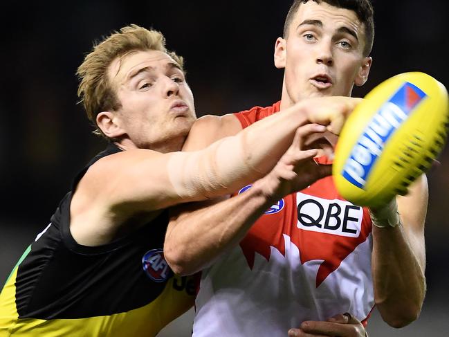 MELBOURNE, AUSTRALIA - APRIL 20: David Astbury of the Tigers spoils a mark by Tom McCartin of the Swans during the round 5 AFL match between Richmond and Sydney at Marvel Stadium on April 20, 2019 in Melbourne, Australia. (Photo by Quinn Rooney/Getty Images)