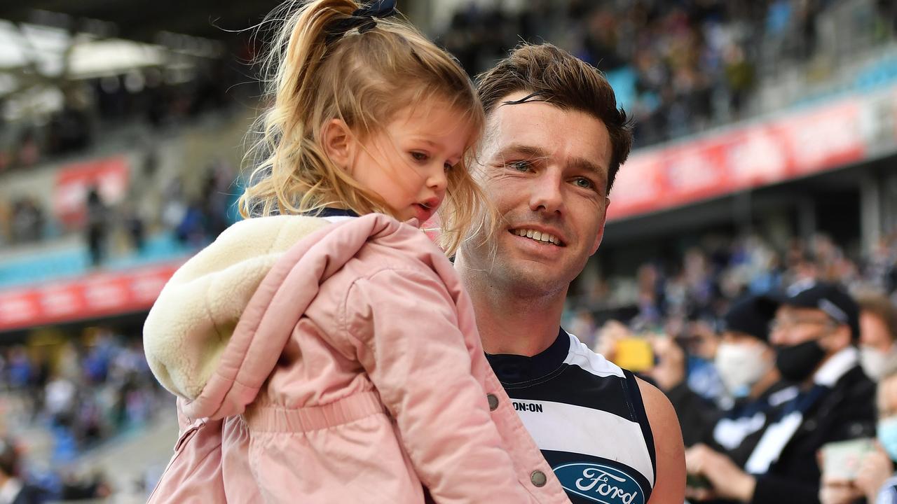 Shaun Higgins celebrates his 250th game against his old club with his daughter. Picture: AFL Photos/via Getty Images