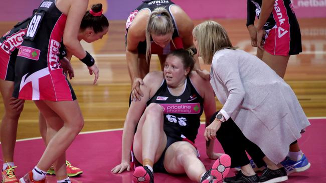 Thunderbirds check on Emma Ryde after she injured her knee against the Giants on Sunday. Picture: AAP Image/Kelly Barnes