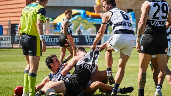 South's Jake Summerton and Port's Peter Ladhams getting pulled off by South's Bradley Crabb in last week’s SANFL match at Alberton. Picture: MATT LOXTON