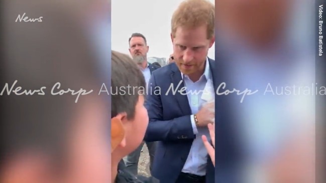 Prince Harry comforts young boy who lost his mum