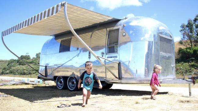 Scott and Jessie Curtis-Griffiths’ kids love hitting the road with the old caravan. Picture: andrewnorthover.com.au